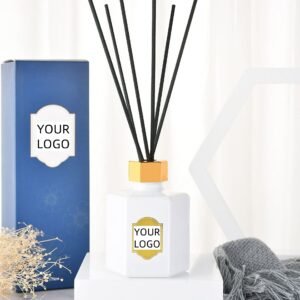 Luxury reed diffuser with black sticks, gold cap and custom logo bottle, paired with premium blue packaging box for private label home fragrance