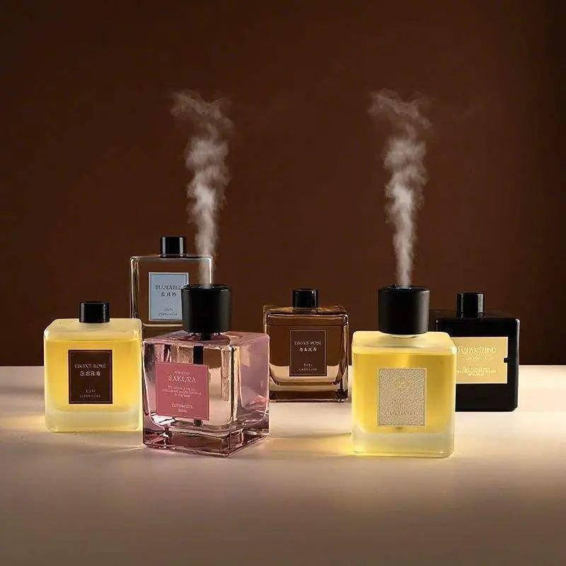 Smart home fragrance diffusers releasing fine mist, representing IoT and atomization technology.