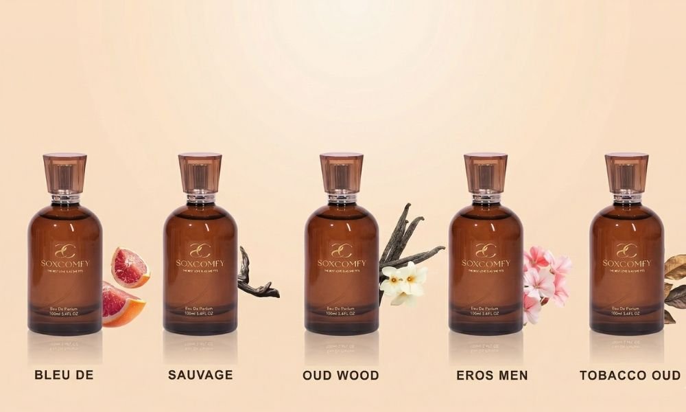 A collection of five 100ml SOXCOMFY Eau de Parfum bottles featuring popular men's scents like Sauvage and Oud Wood, with natural ingredients.