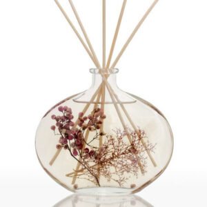 Decorative glass reed diffuser with dried flowers inside, elegant home fragrance diffuser for modern decor and aromatherapy use